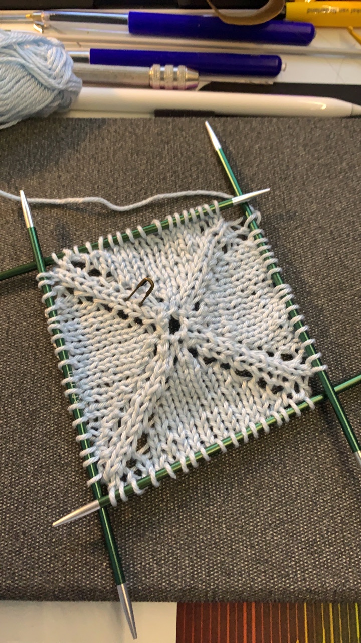 Knitted granny square in light blue